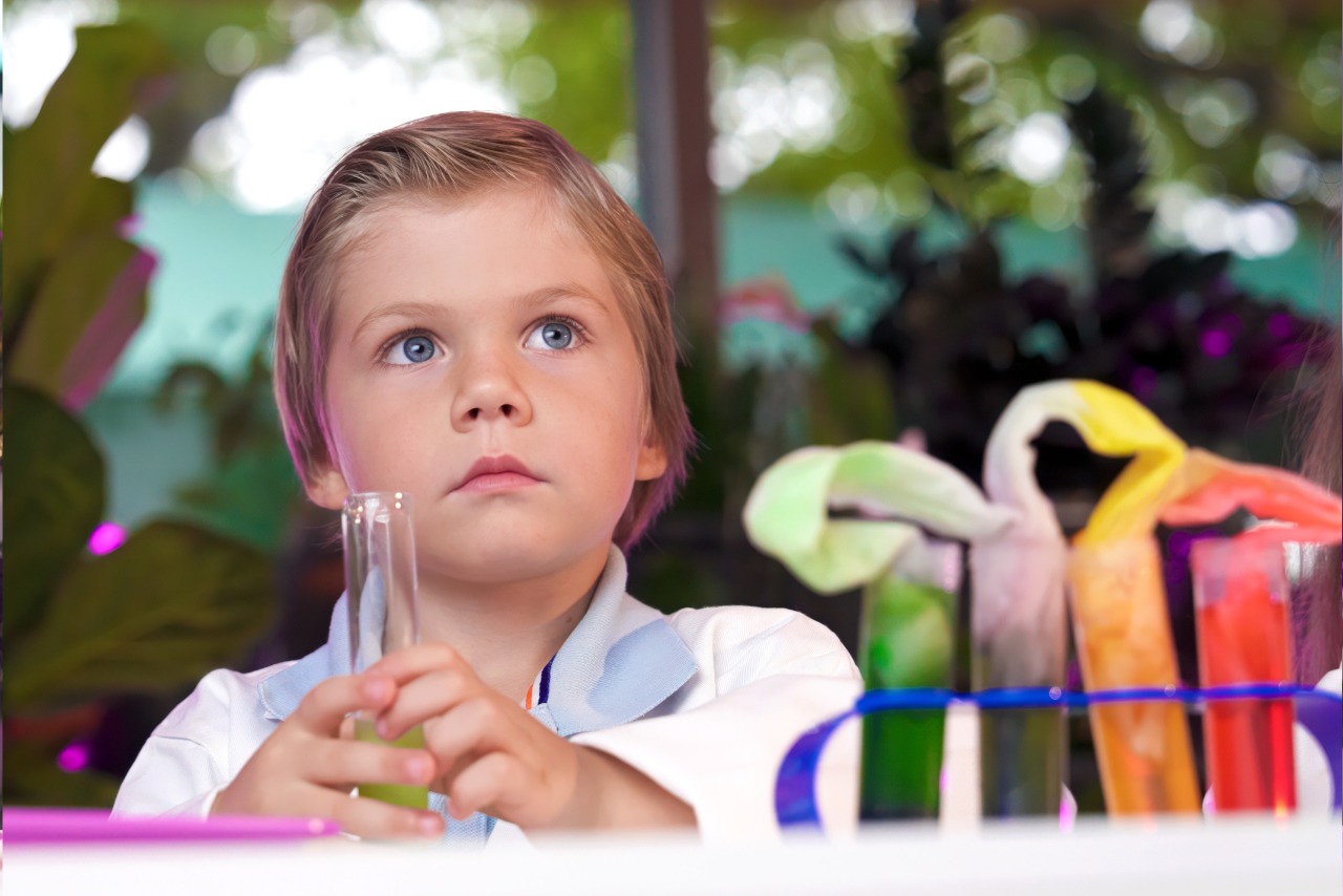 boy in preschool in science class
