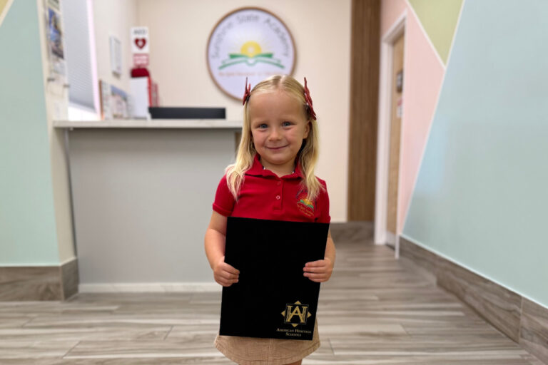 alumni girl holding diploma