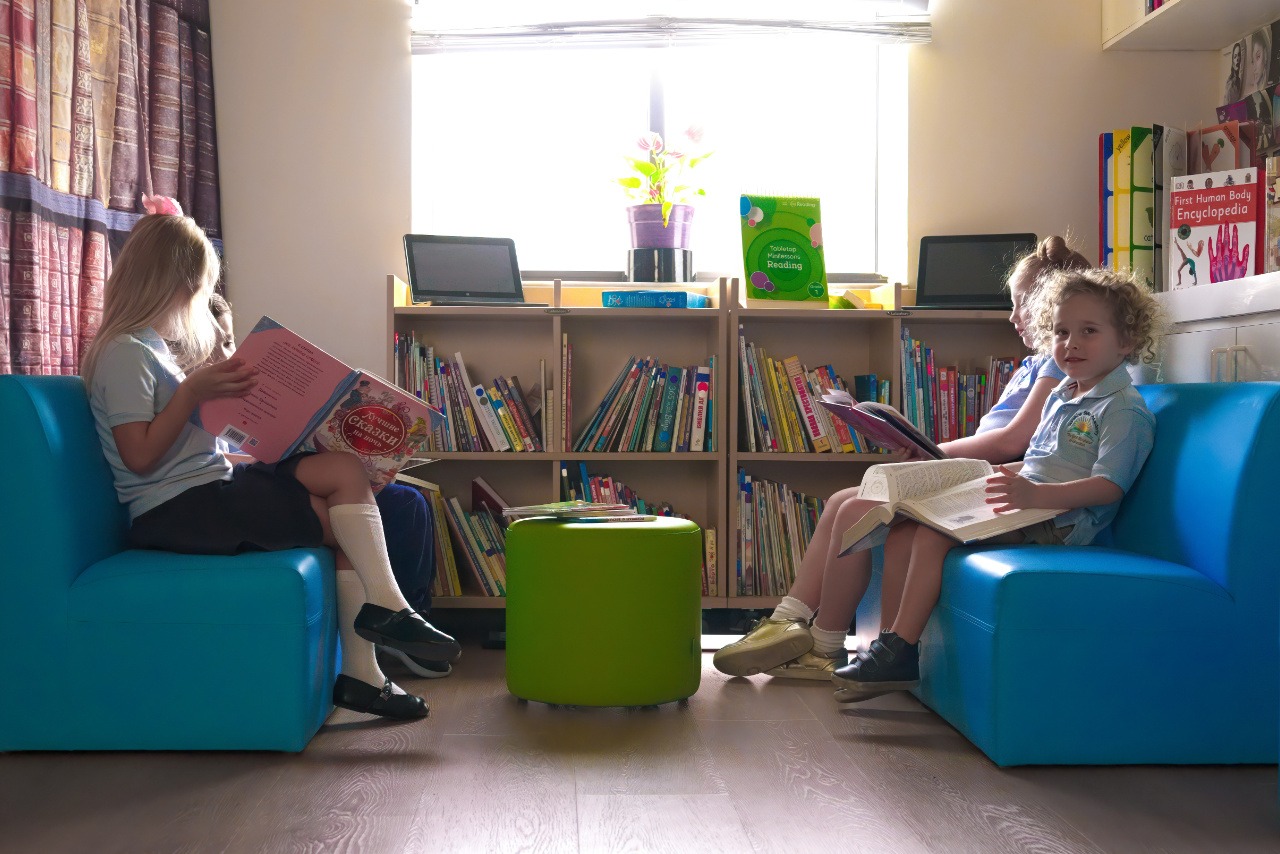 kids sitting in a library